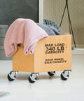 12 Pack 2-Inch Swivel Casters With Brakes for Cart or Equipment, hard rubber wheels, mounted on a wooden crate with blankets