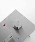 Shower System Combo with Hand Shower and Tub Spout control panel featuring symbols for temperature and water flow settings, brushed nickel finish.