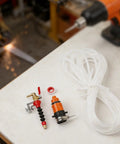 Killer Dust Removal System For Cutting Machines With Precision Water Spray Nozzle Kit And Ten Meter Hose, components on workbench.