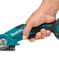 Badass Compact 12V Max Lithium Ion Cordless Multi Cutter Slick Flexible Material Trimmer With Lock Off Switch held in hand.
