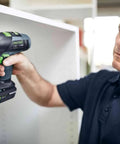 Slick Switching Cordless Drill With CENTROTEC Quick Connect System for effortless drilling in a workshop.