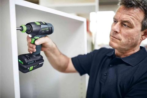 Slick Switching Cordless Drill With CENTROTEC Quick Connect System for effortless drilling in a workshop.