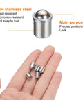 Hand holding 10 Piece Ball Point Spring Plunger Set 6x7mm Stainless Steel for precision positioning and locking.