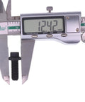 Close-up of a black pressure plate bolt measured with a digital caliper, display shows 12.42 mm