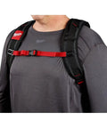 Badass Low Profile Backpack With Twenty Two Pockets And Heavy Load Bearing Harness For Tradesmen Ballistic Canvas Build harness detail showing padded straps on a user