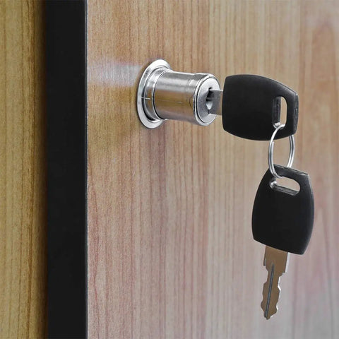 Top Notch Push Plunger Lock For Cabinets And Desk Drawers Keyed Alike Design Two Piece Set with key in lock on wooden surface.