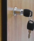 Heavy Duty Smooth Glide Push Plunger Lock 3/4 Inch Cylinder Diameter 1.5 Inch Length Solid Zinc Chrome Finish keyed alike lock with keys in wooden cabinet.