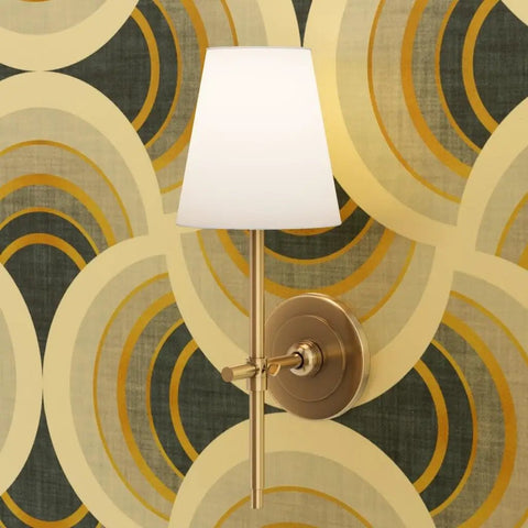 Sconce lamp with white shade and gold finish mounted on Top Shelf Gold Metallic Scallop Wallpaper For Fresh Room Glow Ups.
