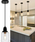 Slick Five Point Five Inch Seeded Glass Mini Pendant Light Featuring Badass Black Metal Hanging Fixtures For Kitchen Island And Dining Room.
