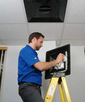 Person installing Lay In 2x2 Ceiling Diffuser with 3 Cone Supply and 8 Inch Pre Molded Boot in ABS Plastic Black