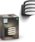 Hue Lucca White Outdoor Wall Light With Dusk To Dawn Sensor shown with packaging and wall installation
