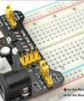 Kickstart Your Prototypes With This Straight Up Dope 3.3V 5V MB102 Breadboard Power Supply Module With No Fuss Toggle Switch And Battery Cable Perfect For Arduino Tinkering Smooth Operation Always On Tap Pack Of Three on a breadboard