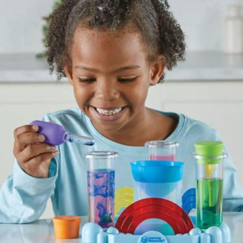 Child using Rainbow Reactions 14 Piece Preschool Science Lab Kit For Kids Age Four And Up With Color Mixing Experiments And Hands On Colorful STEM Activities For Boys And Girls