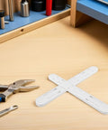 8 Pack White ABS Cabinet Drawer Slides With No Fuss Tool Free Installation on a workbench with tools nearby