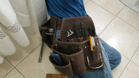 Top Grain Leather Construction Tool Pouch Dominant Right Side With 9 Pockets And A 3 Inch Belt Slit Pro Grade Built For Tough Tradesmen Who Value Quick Access And Real World Durability Boss Level shown on tile floor with tools inside