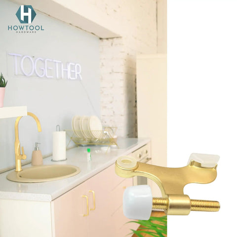 Solid Five Pack Of Heavy Duty Hinge Pin Door Stoppers In Premium Satin Brass Matte Gold Finish with rubber bumper in kitchen setting.