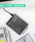 USB 2.0 PCMCIA Card Reader With PC Card ATA And ATA Flash Mass Storage Support on a desk with plug-and-play cable