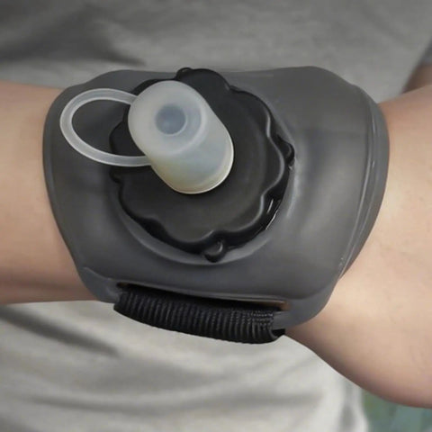 Hydration On The Wrist On The Go 200ml Silicone Leakproof Wearable Bottle with ergonomic hand strap for outdoor activities shown on wrist