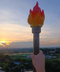 Retro Resin Torch Prop LED Light Handheld Flameless Portable Outdoor Torch Prop Lamp held during sunset.