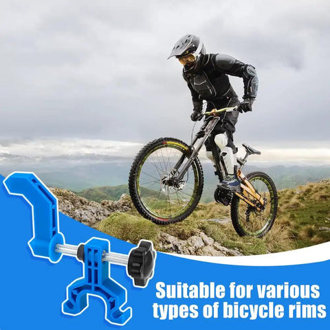 Bike Wheel Truing Stand And Rim Adjustment Tool Kit With Spoke Key And Rubber Strap For Mountain Bikes next to cyclist
