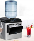 Badass Compact Countertop Ice Maker Churns Fifty Five Pounds Of Crisp Round Cubes Daily with water dispenser and drinks.
