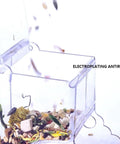 Clear Acrylic Automatic Pet Food Dispenser 300ml for Small Animals and Birds, open with scattered food inside.