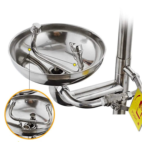 Close-up of Hardcore Heavy Duty Stainless Steel Eyewash System with dual nozzles and drain in a solid basin.