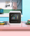 Compact Countertop Dishwasher Packs Six Place Settings And Five Wash Cycles To Get Dishes Done Quick Featuring Steam Baby Sterilizer Auto Air Dry And Smart Led Interface Ideal For Tight Apartments in a colorful kitchen.