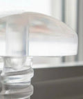 Premium Drapery Track Stoppers Keep Your Curtains Locked Down Totally Slip Free Tough Snap Install For Narrow Window Channels close-up view of a clear plastic curtain track stopper.