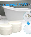 Tile Repair Kit 2 Pieces 100g Quick Dry Ceramic Tile Adhesive With Agent And Hardener For Cracks And Chips In Bathroom And Floor Surfaces DIY Home Fix, close-up of product containers in front of a bathtub.