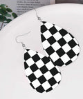 Black And White Checkerboard Teardrop Leather Earrings For Women, Faux PVC Silver Plated Hooks, visible on a plate.