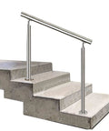 Dang Solid Two Tier Outdoor Stainless Steel Railing For Front Porch And Patio Steps With Secure Floor Mount Base offering support on concrete steps.
