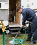 Front view of LANDNOR RV water pressure regulator valve with gauge, brass lead-free body and adjustable knob.