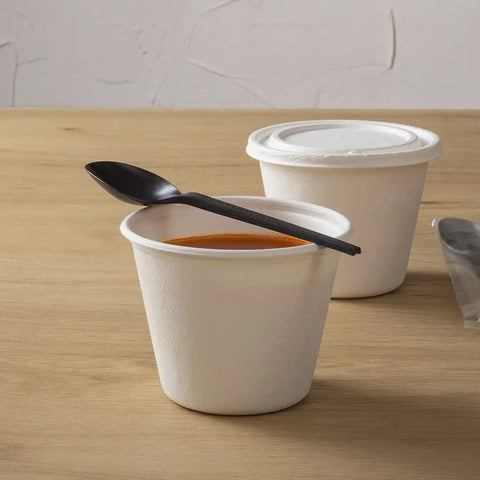 Six Point Five Inch Wrapped Compostable Spoons For Hot And Cold Food 250 Individually Wrapped Plant Based Black CPLA Disposable Utensils BPI Certified Eco Friendly Cutlery For Restaurants And Events black CPLA spoon over soup cup