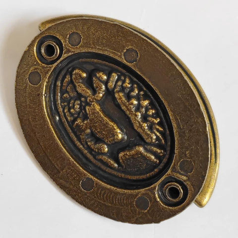 Oval plate with deer pattern from 4-Pack Vintage Style Antique Brass Deer Pattern Bail Drawer Pulls, 2-Inch Center-To-Center, 51mm.