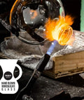 Hand-blown glass being shaped over a flame, illustrating craftsmanship in Three Cup Tabletop Siphon Coffee Maker With Alcohol Burner Gravity Brew For Clean Rich Smooth Coffee And Aromas Safe Sleek Stand Vacuum Seal Technology Lets You Brew On Your Counter.