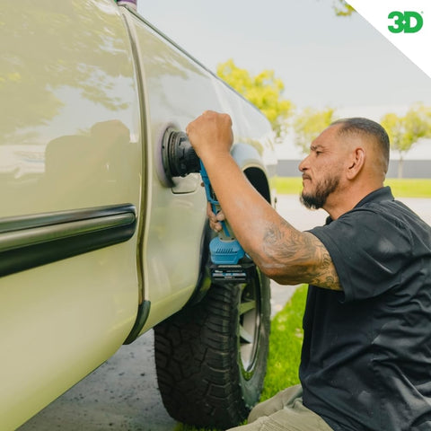 Man using All In One Car Polish And Wax That Corrects Scratches And Swirls Provides Clear Coat Safe Sealant And A High Gloss Finish Easy One Step Application 16oz Made In USA on truck door