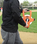 Person using NRS18M330 Nylon Reinforced Tape Measure With Beast Speed Rewind And Double Hook 100M on a sports field