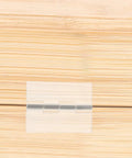 Self Adhesive Clear Acrylic Flush Hinges Set Of 5 for cabinets, close-up on wood surface showing hinge detail and invisible finish.