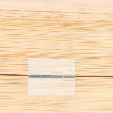 Self Adhesive Clear Acrylic Flush Hinges Set Of 5 for cabinets, close-up on wood surface showing hinge detail and invisible finish.