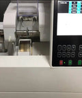 Close-up of Automatic Edge Grinding Machine For Eyewear With Scanner And 7 Inch Touch Screen showing control panel and grinding area.