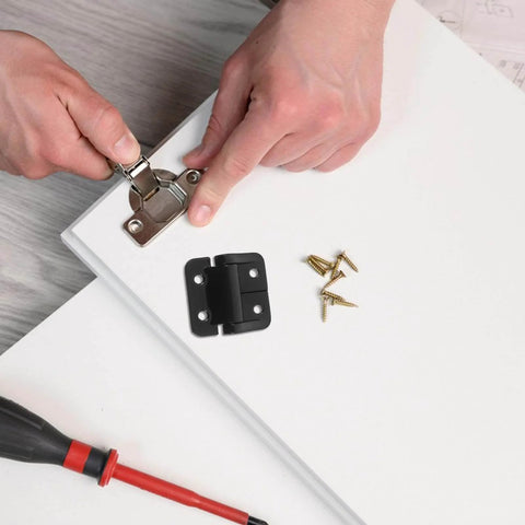 Installation of Torque Hinge For Cabinet Doors DIYEAH Go-To Heavy-Duty Alloy 1.8Nm on white cabinet door with screws and tools.