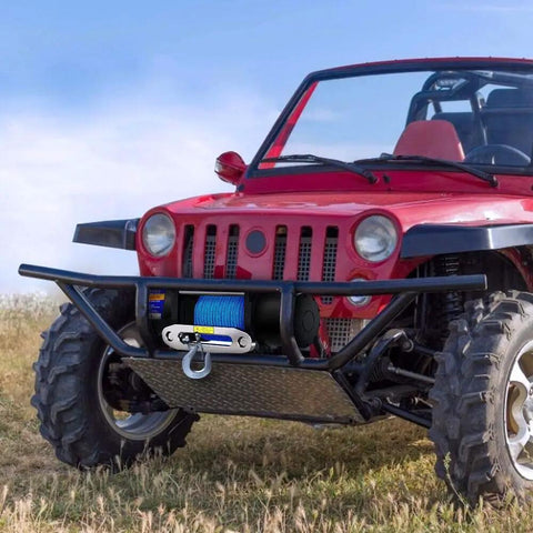 ATV with 12V 4500lb Electric Winch With Synthetic Rope mounted, featuring 50 Ft Rope, Lightweight Yet Tough, on rugged terrain