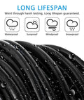 Close-up of black waterproof Workhorse 3 Conductor 18 AWG Copper Wire Extension Cord 100 Ft with water droplets on surface