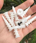 Hand holding white plastic self drilling drywall anchors set 100 pcs with screws and reusable storage case for home improvements