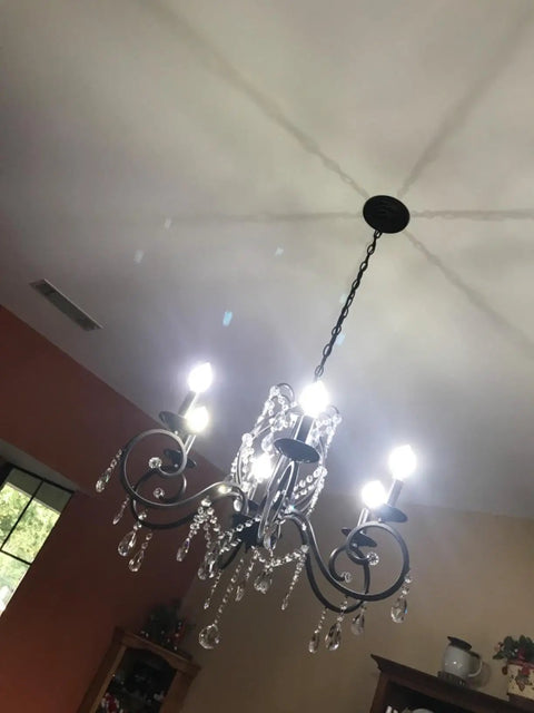 Bronze Crystal Six Light Candle Chandelier With Metal Pendant Ceiling Light illuminating a room, vintage bronze finish