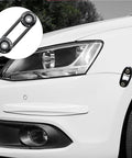 Universal Car Bumper Quick Release Kit with 4 black release tabs on white car, close-up of front bumper and headlight.