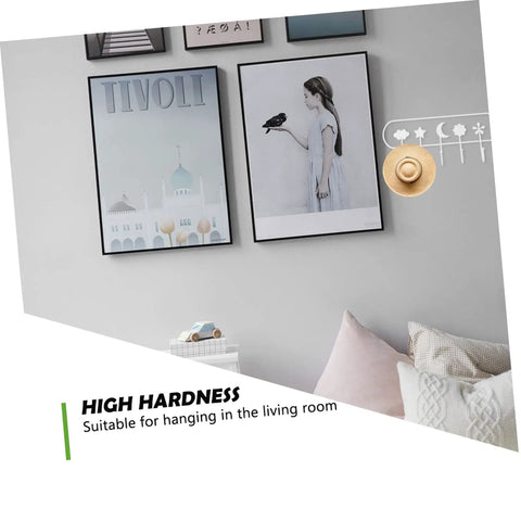 Heavy Duty Adhesive Hook Set That Stays Rock Solid No Sweat Install For Hanging Towels Coats Bags Keys Total Entryway Essential on a wall with framed art.
