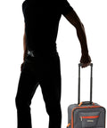 Rockland expandable softside upright luggage, charcoal with orange zipper accents, front view.