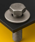 Stainless steel flat washer (3/4 in OD) under a hex nut on a bolt through a black metal plate